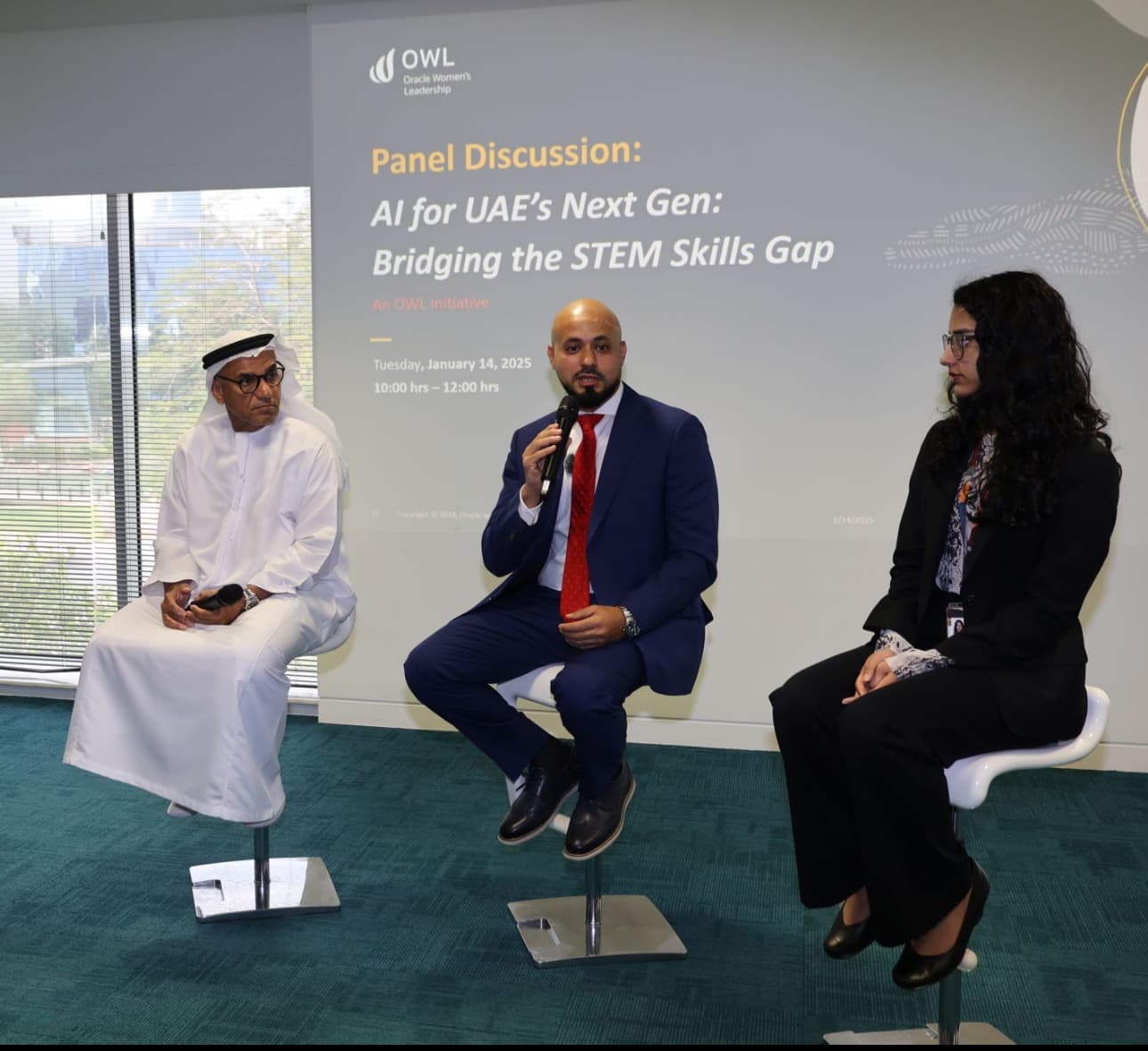 Mohammad Elmoshnib speaking on a panel, in front of a slide reading Panel Discussion: AI for UAE's Next Gen, Bridging the STEM Skills Gap